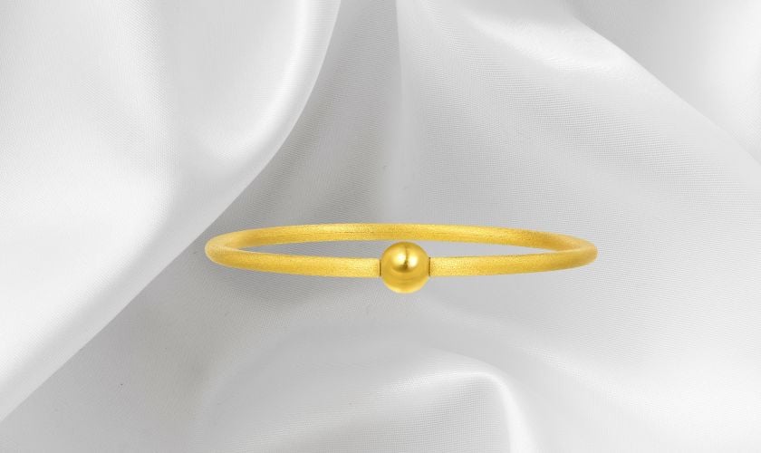 Lắc tay vàng 9999 trơn có charm hạt châu